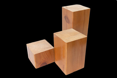 varnished wooden bars on an isolated black background, close-upの写真素材