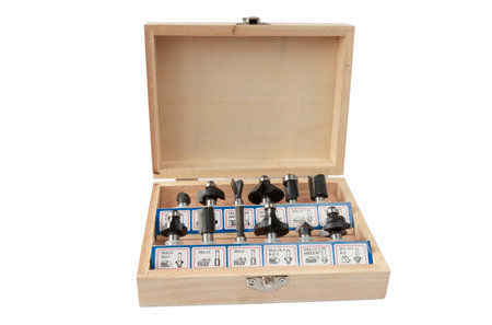 a set of milling cutters for processing wooden products with a joiner's hand power tool, on a white backgroundの写真素材