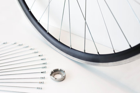 rim and spokes of a bicycle wheel, wheel lacing, close-up on an isolated backgroundの写真素材