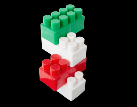 assembled parts of a children's plastic constructor on an isolated background. colored cubesの写真素材