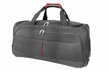 full black travel bag on isolated white backgroundの写真素材