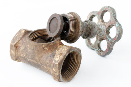 disassembled old water faucet, broken water tap, on isolated white backgroundの写真素材