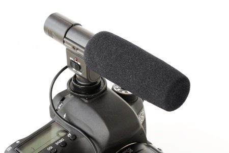 Dnipropetrovsk, Ukraine - July 22, 2022: audio microphone mounted on a DSLR camera Canon, on a white isolated backgroundのeditorial素材