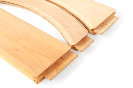 transverse wooden blanks for the assembly of paneled doors, processed by a milling machine in a carpentry workshop, on an isolated backgroundの写真素材