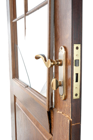 broken wooden door, close-up on a white isolated background, the concept of replacing or maintaining old doorsの写真素材