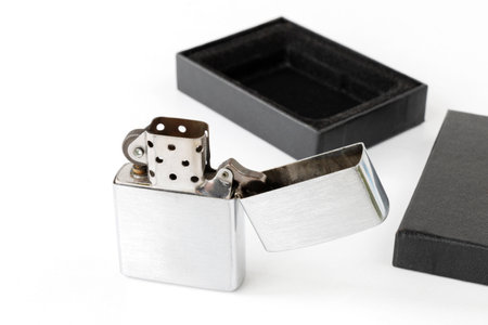 gasoline metal lighter with a gift box, on a white backgroundの写真素材