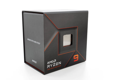 Dnipro, Ukraine - June 26, 2023: A close-up of an AMD Ryzen 9 7900X processor in a packaging box, isolated on white backgroundのeditorial素材