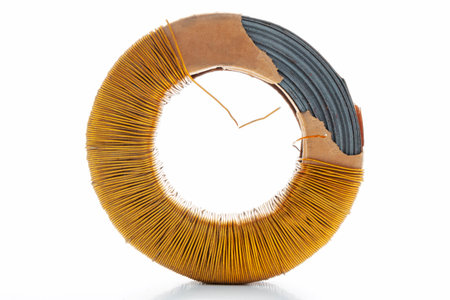 Electric transformer copper coil inductor on white background, close-upの写真素材