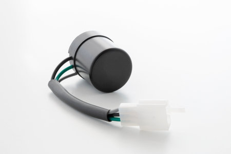electric motorcycle turn relay 12v, with terminal and wires on a white backgroundの写真素材