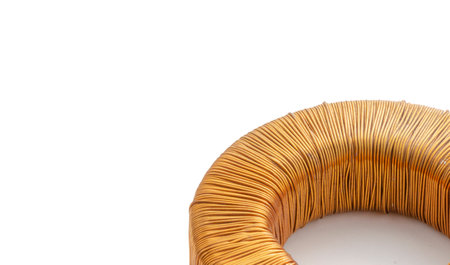 Electric transformer copper coil inductor on white background, close-upの写真素材