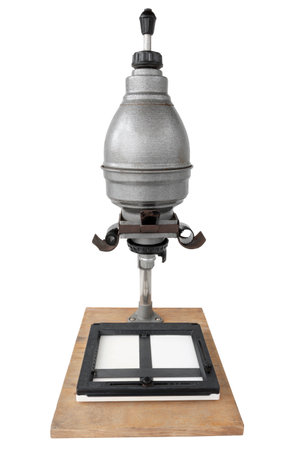 Vintage photographic enlarger for projecting photo negatives, isolated on white background, Contains clipping pathの写真素材