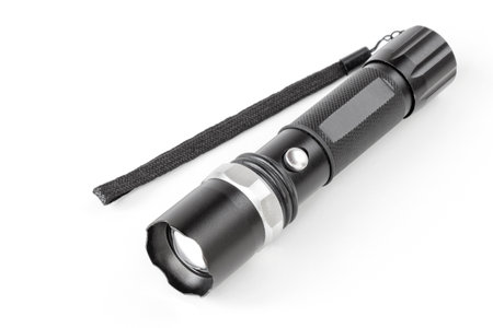 tactical led flashlight isolated on white backgroundの写真素材