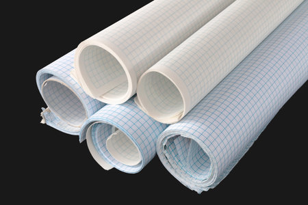 rolled checkered paper, notebook paper, isolated blackの写真素材