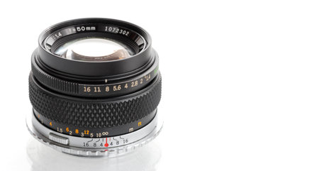 vintage portrait lens of a film camera, lens 50mm, in front of a white background, mockup, copy space for textの写真素材