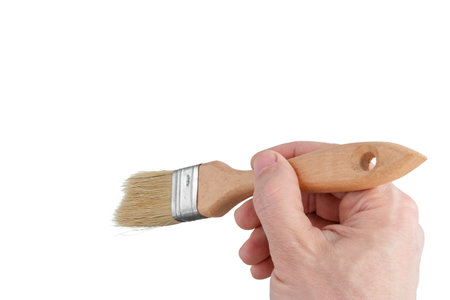 hand paints with a brush, hand holding paintbrush, cut outの写真素材
