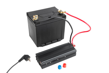 Power inverter connected to a car battery, 12v DC to AC converter 220v, on isolated whiteの写真素材