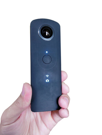 ultra-thin 360-degree camera in hand, close-up, cut-out