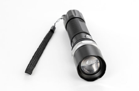 tactical led flashlight isolated on white backgroundの写真素材