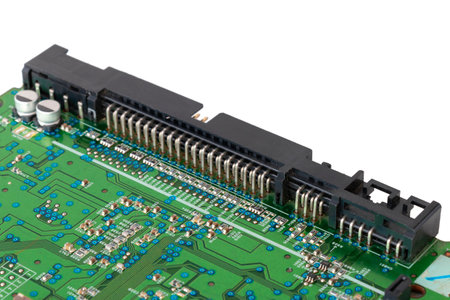 CD-ROM drive motherboard with green print and chip, close-upの写真素材