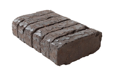 peat fuel briquettes for use on open fires, an alternative type of fuel for heating. Close-up, on isolated whiteの写真素材