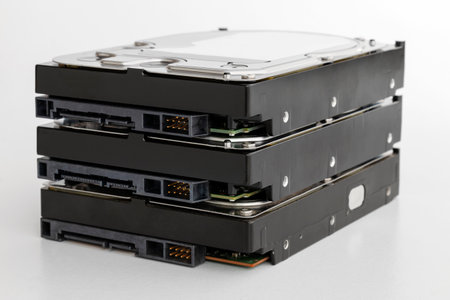stack of hard drives, 3.5 inch hard drives with SATA interface isolated on white background