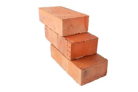 solid fireproof clay brick used for the construction of fireplaces and stoves, on an isolated white backgroundの写真素材