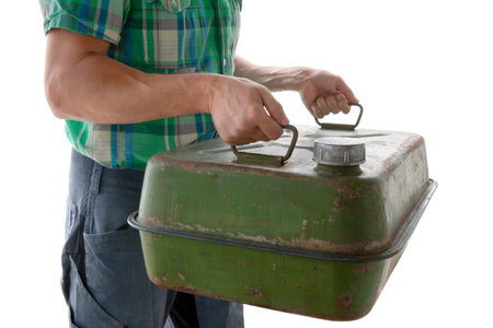 scene of man holding canister gasoline, man holding khaki metal canister 40 liter, cut out, isolatedの写真素材