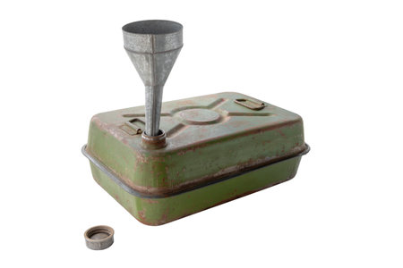 battered military canister for gasoline and diesel fuel, 40 liters, with a funnel in the neck, cut outの写真素材