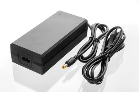 Electric bike charger, AC adapter on isolated white backgroundの写真素材