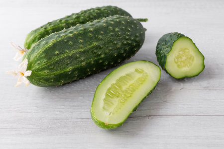 homemade cut cucumbers on white table, close-upの写真素材