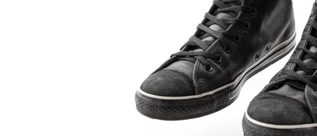 element of leather black sneakers, sports shoes, close-up, with copy space, isolated on white backgroundの写真素材