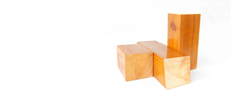 geometric figure made of trimmed lacquered wooden bars on an isolated white background, with copy spaceの写真素材