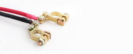 Positive and negative terminals for connecting to a battery on an isolated white background, with copy spaceの写真素材