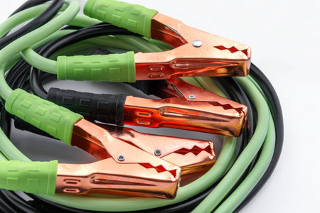 Battery jumper cable, positive and negative terminals. Motor car's starter cable.