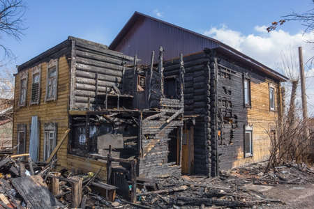 Burnt wooden house. House after the fireの写真素材