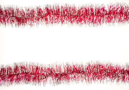 Christmas tinsel on whiteの写真素材