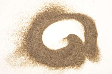 Sand pile isolated on white backgroundの写真素材