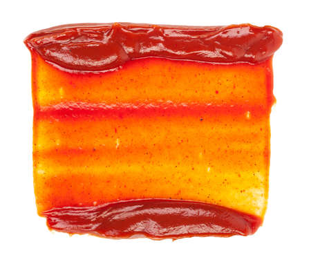 Smeared red ketchup on a white backgroundの写真素材