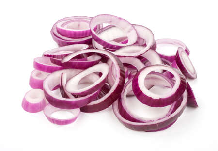 Sliced red onion rings on a wooden kitchen boardの写真素材