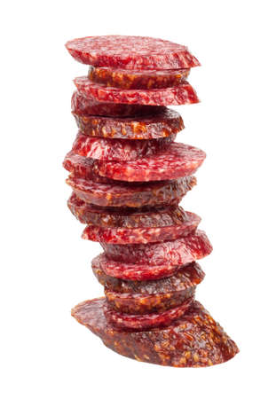 Smoked sausage slices stack on white backgroundの写真素材