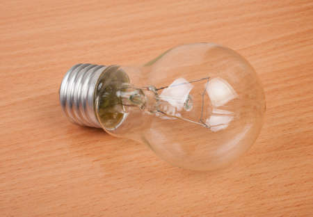 Incandescent lamp lying on the tableの写真素材