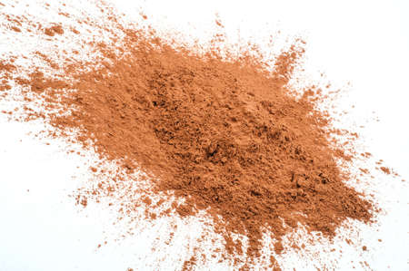 Pile cocoa powder on white backgroundの写真素材