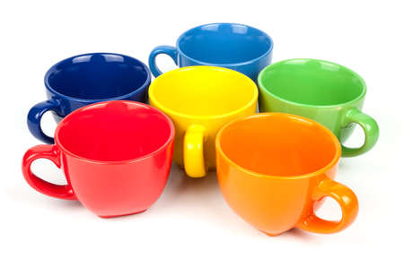 Multi-colored coffee cups on white