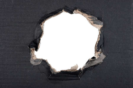 Hole in black cardboard. Texture for design