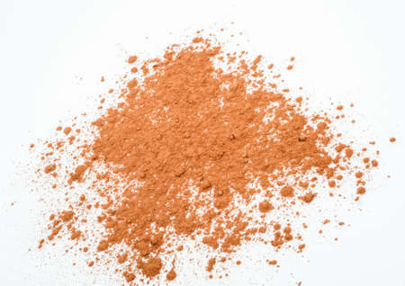 Pile cocoa powder on white background