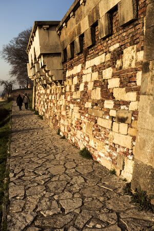 Stone path and brick wall in the park of Kalemegdan in Belgrade Serbiaの写真素材