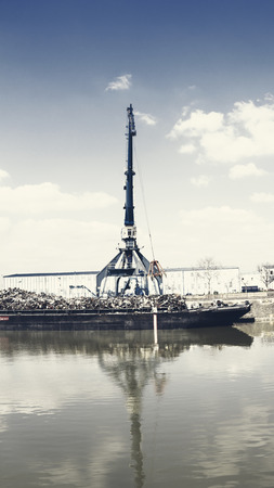 Crane operating in the recycling areaの写真素材