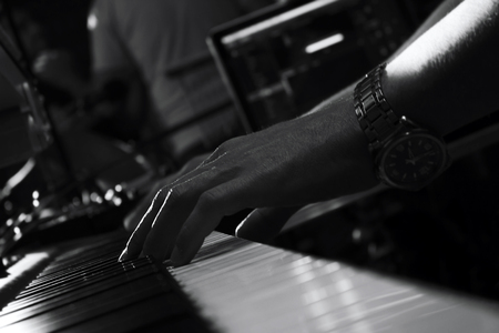 Piano Keyboards In Music Studio And A Hand Of A Musician の写真素材