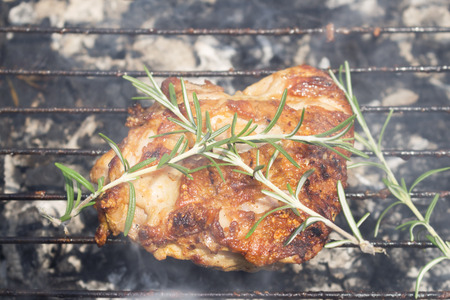 Grilled Deboned Chicken Meat On Smoking Barbecue With Rosemaryの写真素材