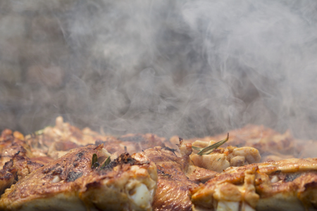 Grilled Crispy Chicken Meat On Smoking Barbecue With Rosemaryの写真素材
